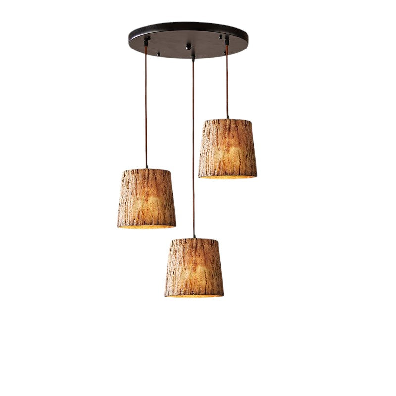 Lampada a sospensione con tronco di legno