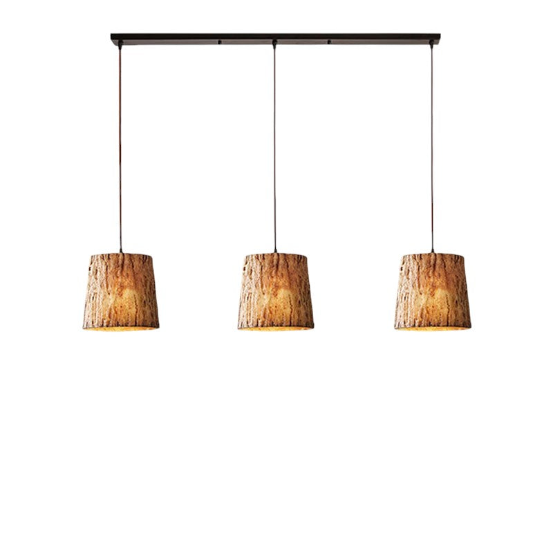 Lampada a sospensione con tronco di legno