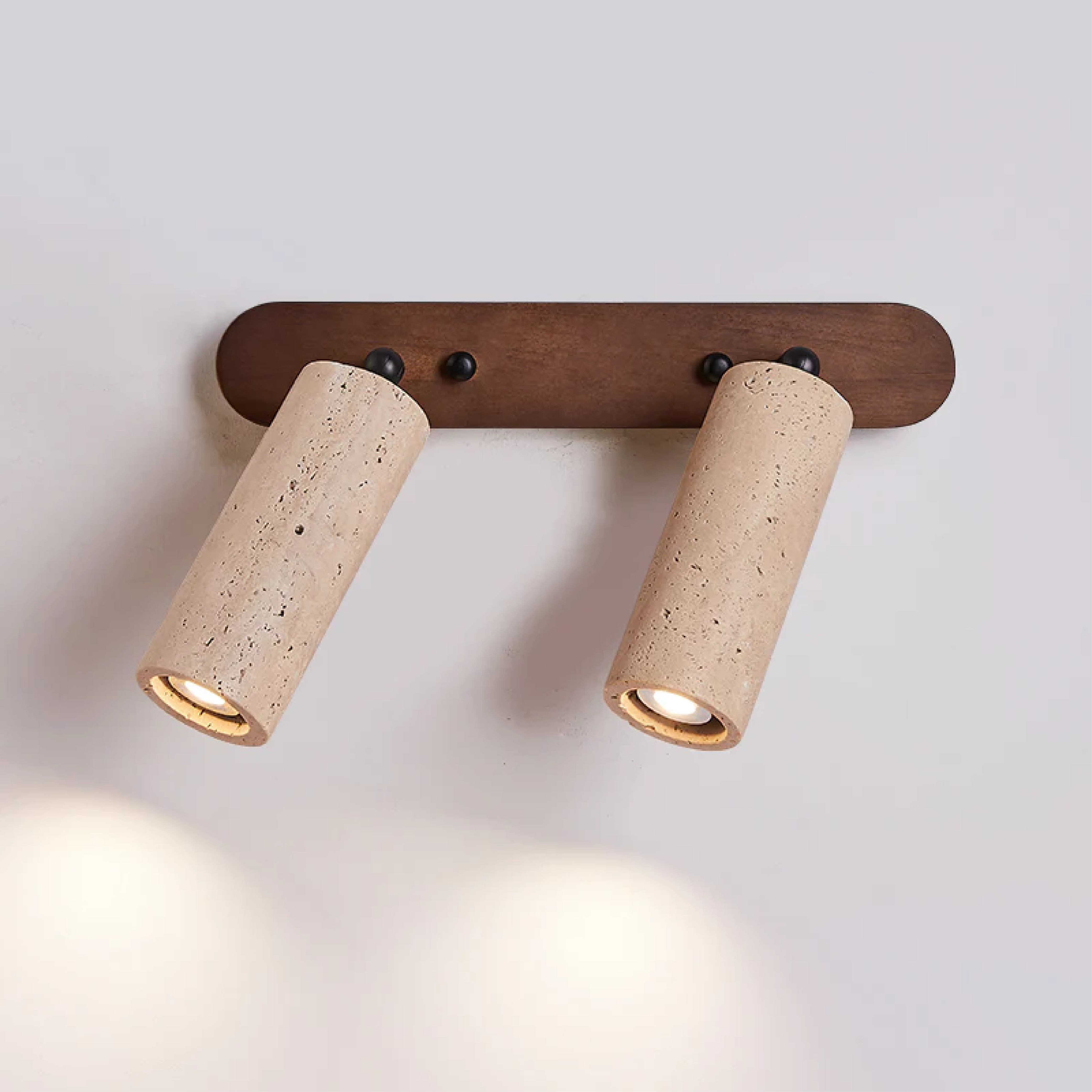 Applique rotanti in travertino